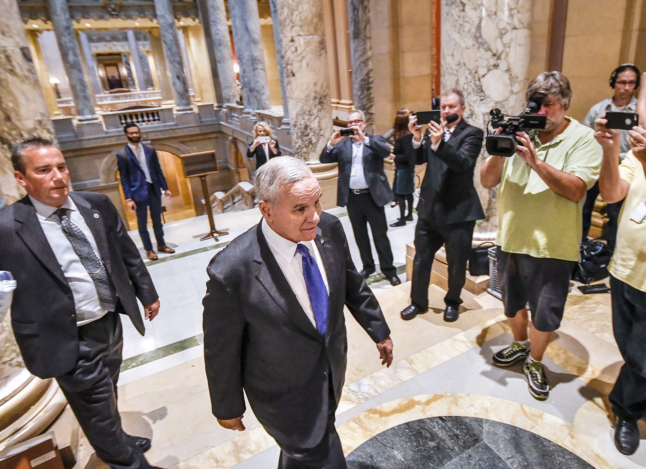 Gov. Mark Dayton enters the Minnesota Supreme Court chambers at the State Capitol on Monday for oral arguments in the Legislature's suit against him. Photo by Andrew VonBank